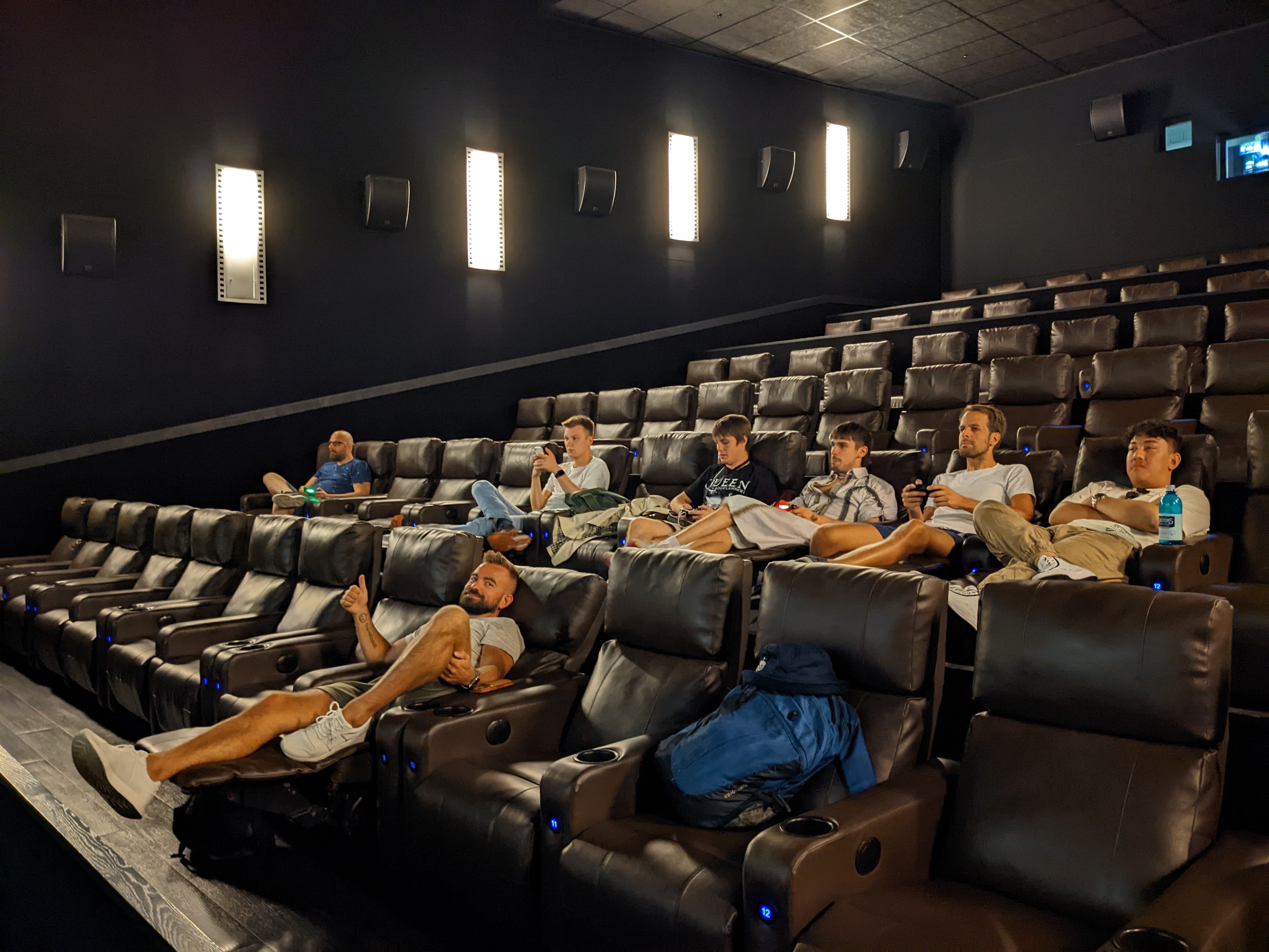 The team in deep focus while playing some games on the cinema screen.